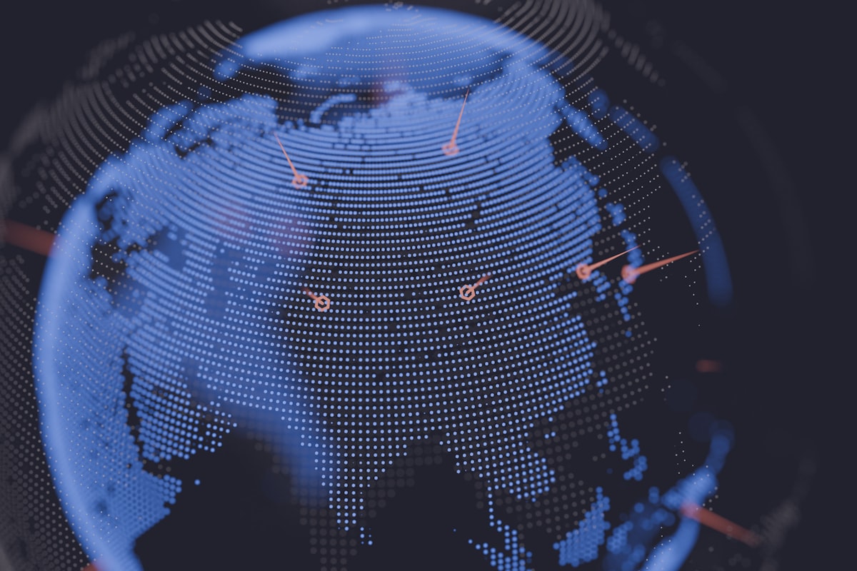 A digital world map with colored data points scattered across continents representing IP geolocation results from a global lookup database