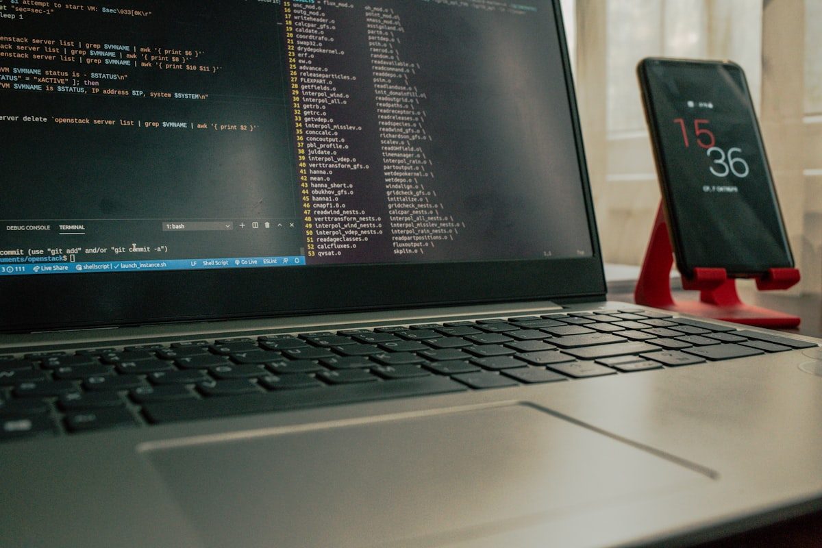 Laptop displaying cybersecurity terminal code in a dark setting representing IP address security threats