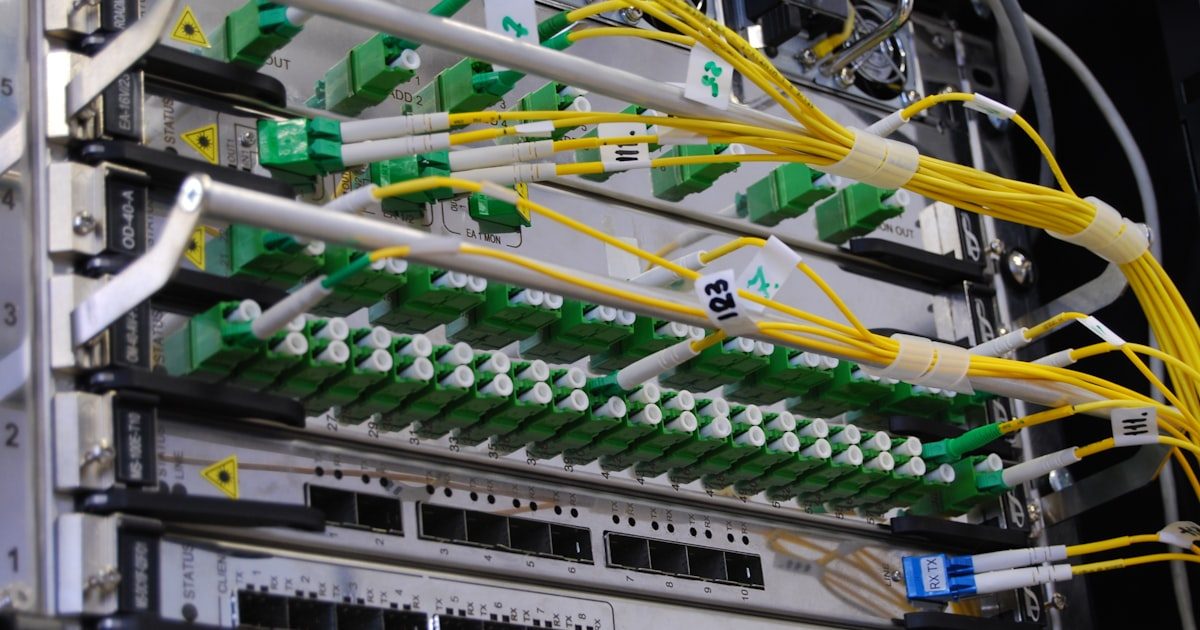 Fiber optic cables carrying data through network subnets