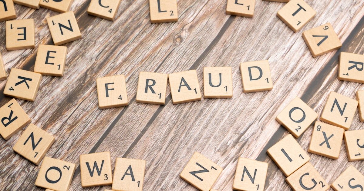Security alert notification on screen representing fraud detection systems