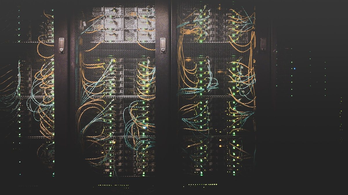 Data center with rows of network cables connected to server racks