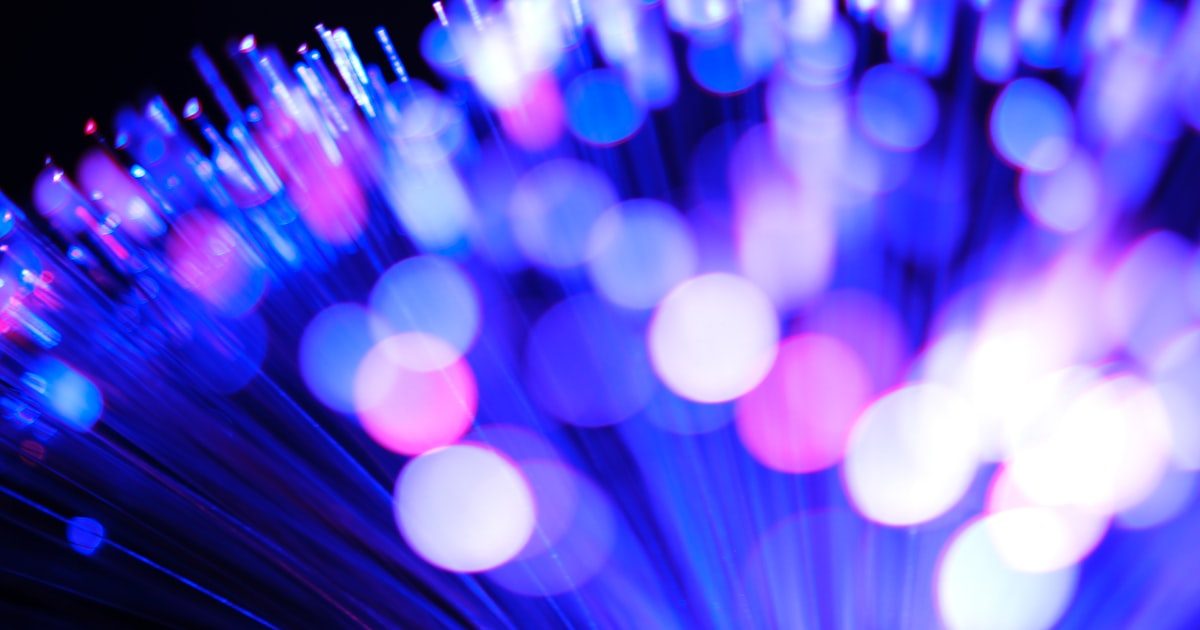 Illuminated fiber optic cables carrying network data